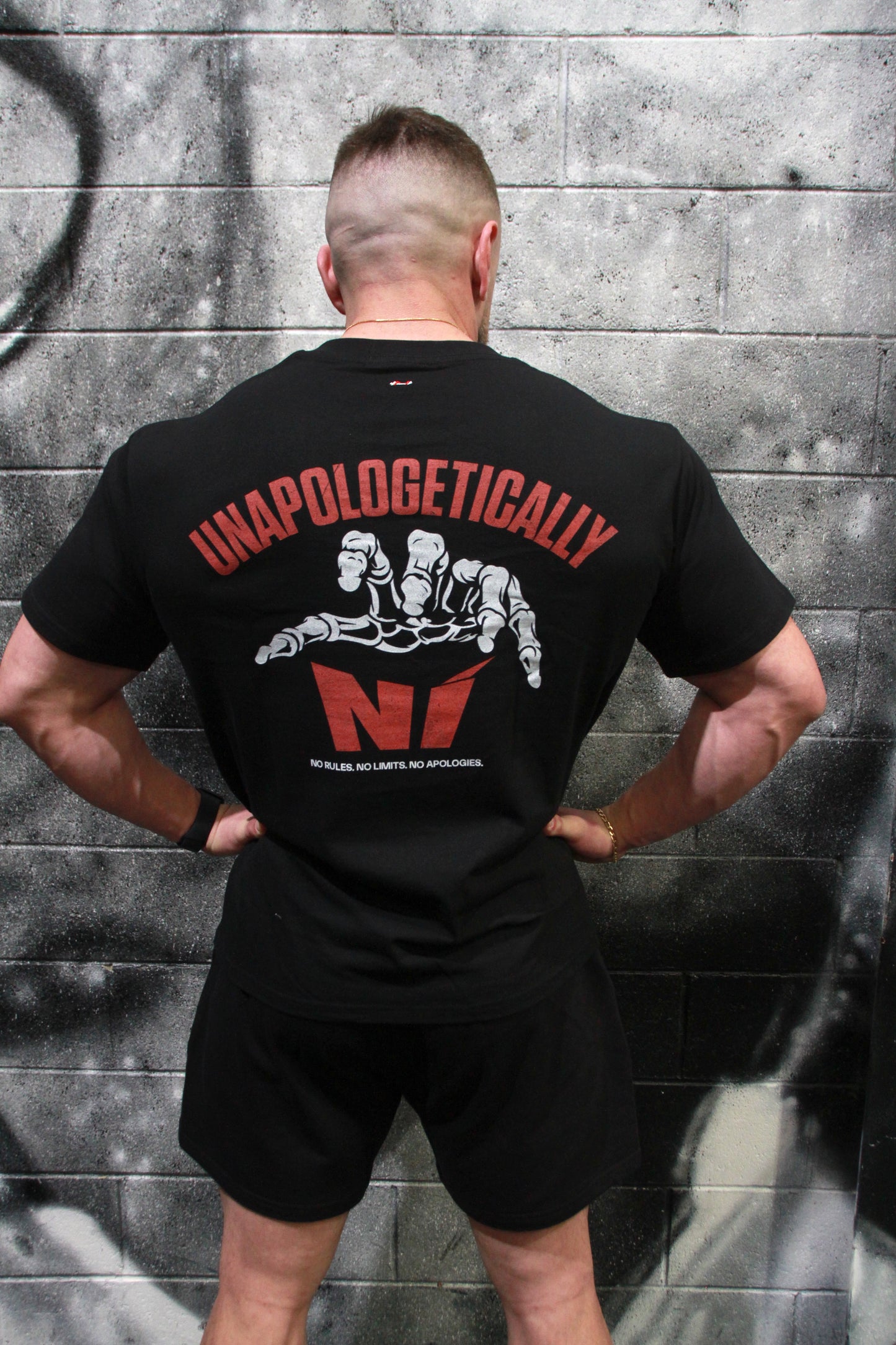 Unapologetic Grip - Oversized Unisex Tee with the skeletal hand graphic
