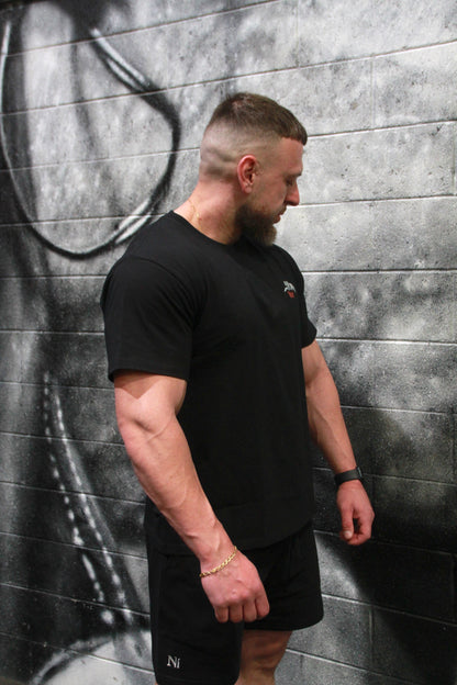 Unapologetic Grip - Oversized Unisex Tee with the skeletal hand graphic